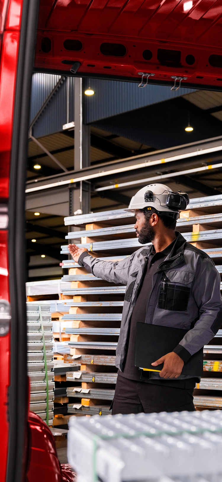 Rear view of a red Citroën Relay in a warehouse during loading, highlighting ease of access and efficient cargo handling.