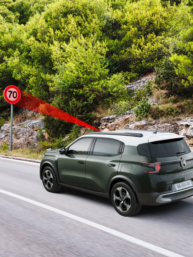 Side driving view of Citroën C3 Aircross SUV showing speed limit recognition for safer, informed and affordable everyday mobility.