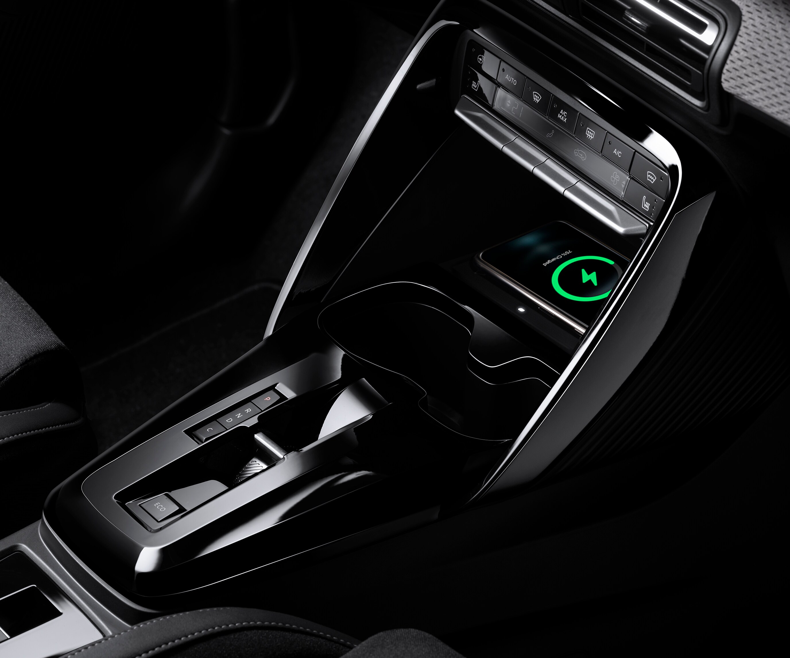 Close‑up console view of Citroën C3 SUV highlighting wireless charging for practical, affordable everyday mobility.