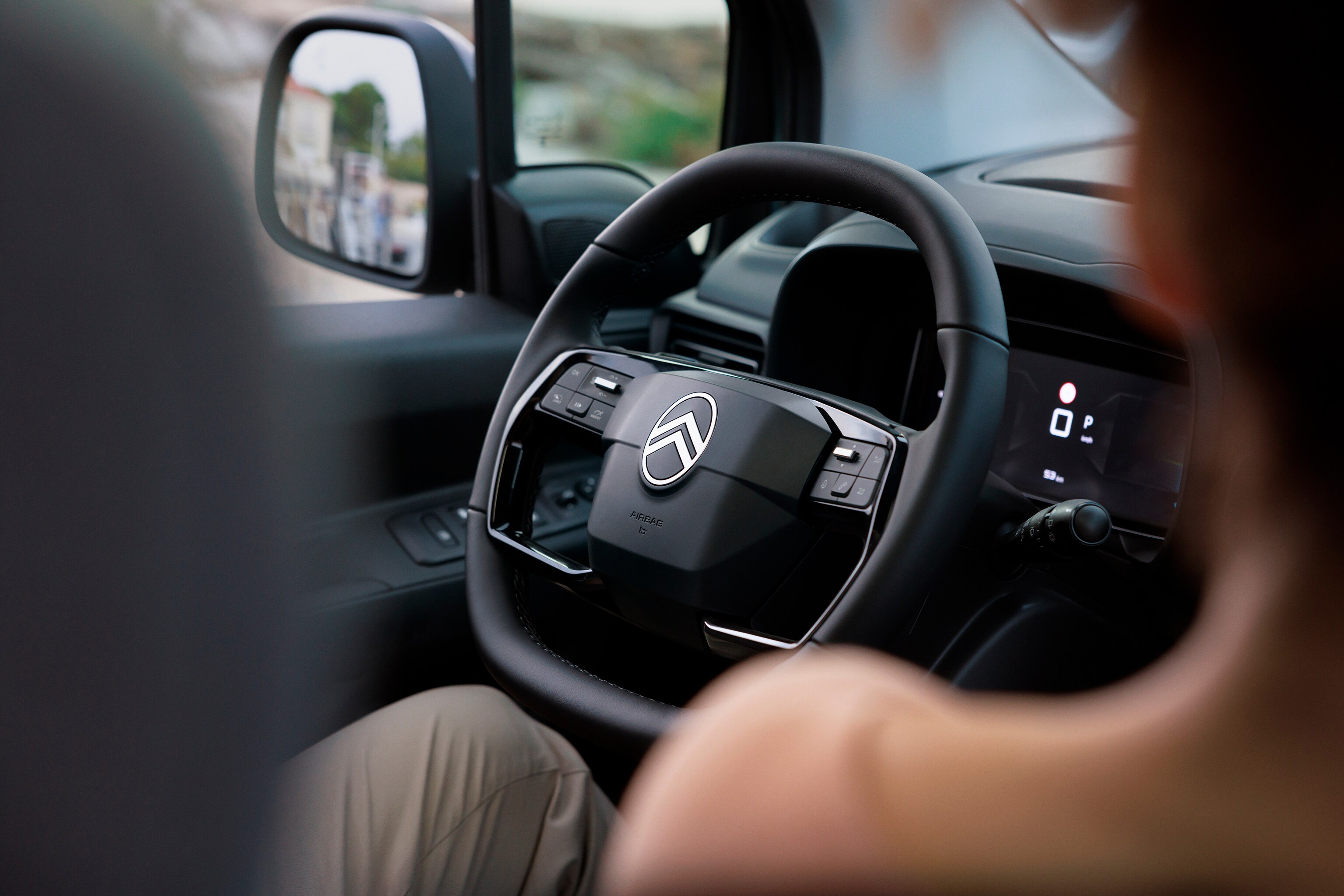 Driver‑view Berlingo showing ergonomic steering wheel, comfort, safety, technology and smoother everyday driving experience