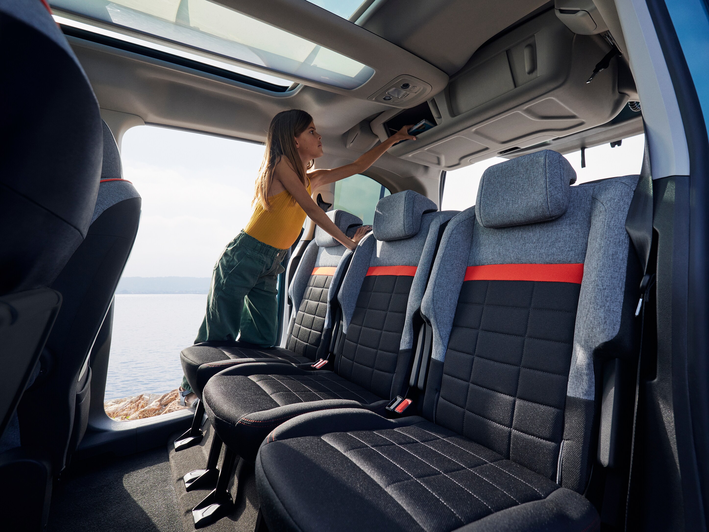 Rear interior view Berlingo highlighting overhead storage, comfort, practicality and improved everyday family convenience