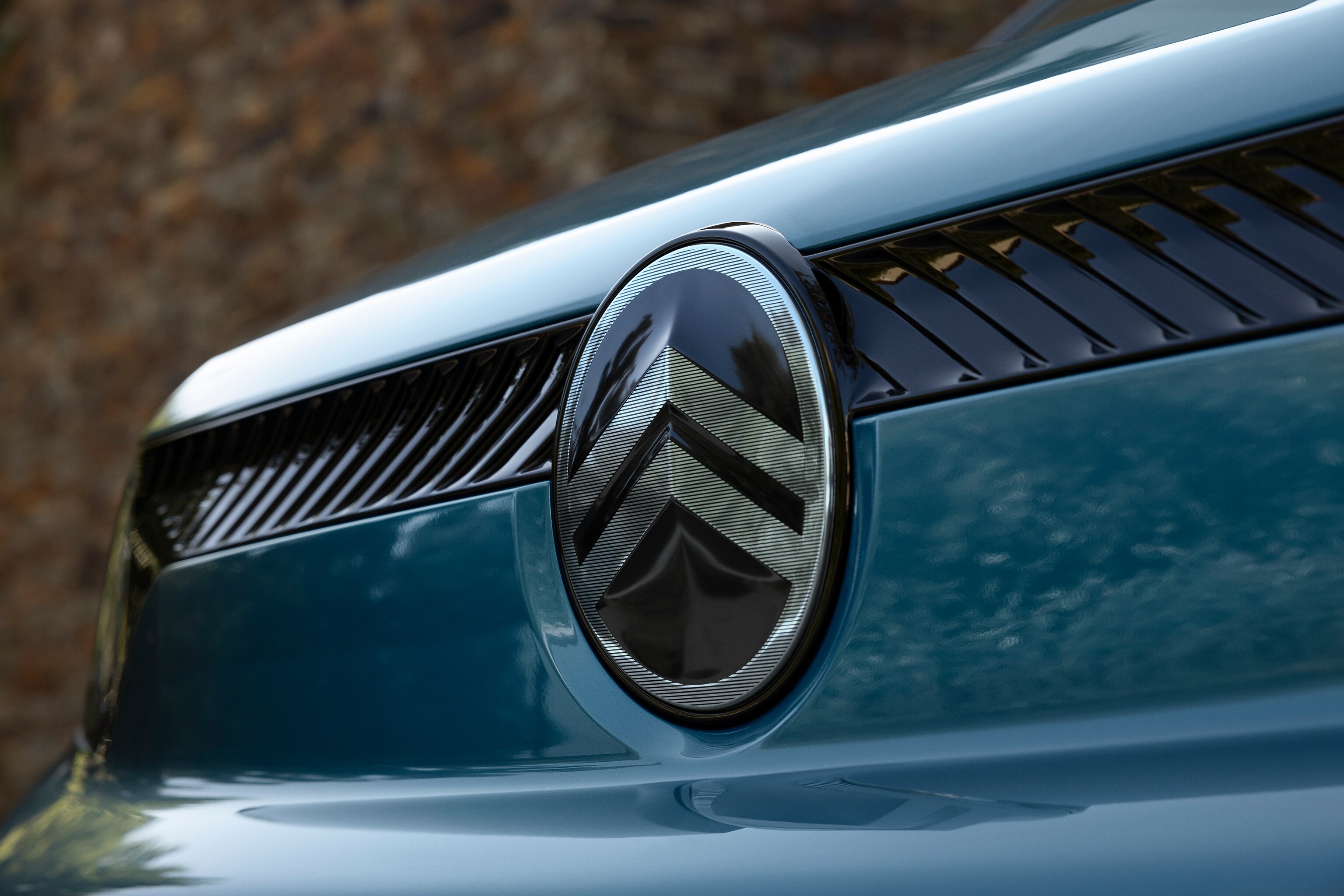 Front detail view Kiama Blue Berlingo highlighting new Citroën logo design, quality, safety and confident modern identity