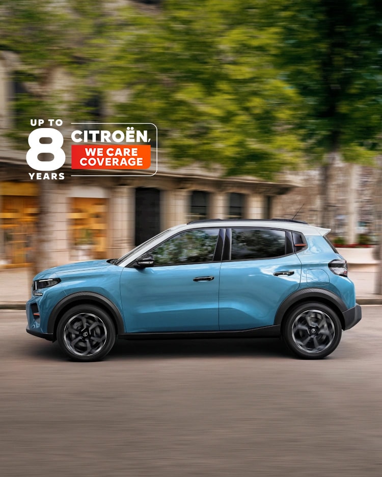 Side driving view of Citroën C3 compact city car highlighting smooth urban performance and 8‑year coverage for confident, affordable mobility.